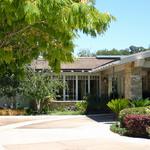 Completed in early 2000's, this 5,500 square foot contemporary ranch home is highly detailed outside and in.  Motor court view of entry porte-cochere.