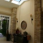 Entry with ridge beam-less ridge skylight.  