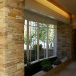 Koi pond with bowed bay window, in five segments, at main gallery.  Pond is on axis across from ding with pool beyond.