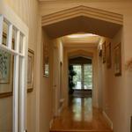 Master bedroom entrance with interior trellis.  Natural light from skylights above and indirect lighting at night creates a lacy textured ceiling with interesting shadow patterns.