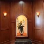 Niche at octagon alcove, where two galleries intersect.  Cherry wood custom  recessed panels and coffer beam ceiling.