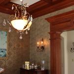 Dining room coffer beam ceiling with custom columns and lintel.