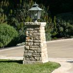 Stone pilaster with lantern at pathway