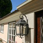 Tuscan cast stone entry surround.