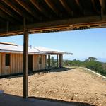 Looking through Family room at Library wing beyond and coastline view.