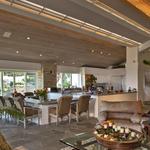 Great room:  Consists of the kitchen with large nook, sunken TV viewing area and sitting area with fireplace.  The baffle running the lenght of the room conceals the skylights above, while allowing nature light into the space, and provide dramatic indirect lighting.