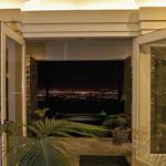 Doors to view from Great Room:  On axis with Main Gallery behind and porch and pool beyond.