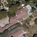 Aerial picture depicts the unique layout of this 5,500 sq. ft. home.  A very narrow lot, with topographical challenges to the southeast,  generated a long and narrow footprint.  With the Vincent Thomas Bridge in the distance, the entry-living wing was angled at a 45 degree to frame this landmark.