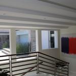 Main stair to basement with courtyard windows in background with outdoor kitchen.