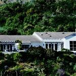 Traditional Ranch home looking across a large canyon (shot with a 300 mm lens).