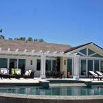 Infinity edged pool and spa with home in background.  Outdoor spaces were an important design consideration.