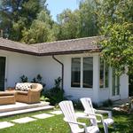 Guest room patio, sideyard under mature tree.